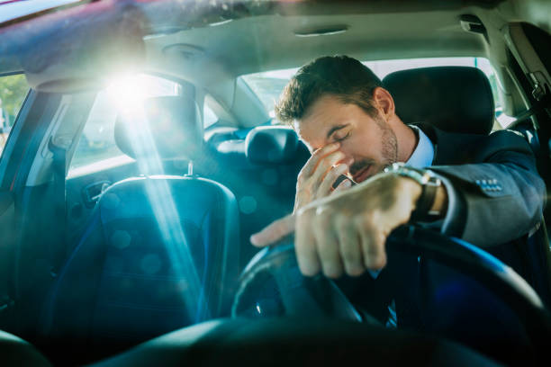exhausted businessman stuck in traffic