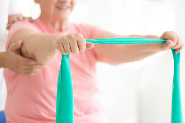 istock Senior woman holding teal scarf 859647358
