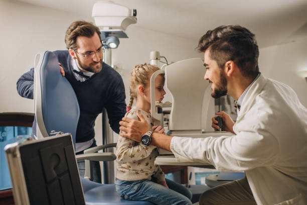 istock Small girl having an eye exam at ophthalmologist's office. 859647396