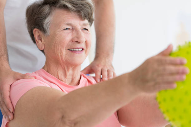 istock Elderly woman enjoying her exercises 859647500