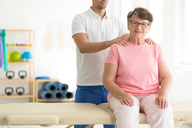istock Elderly lady on physiotherapy 859647506