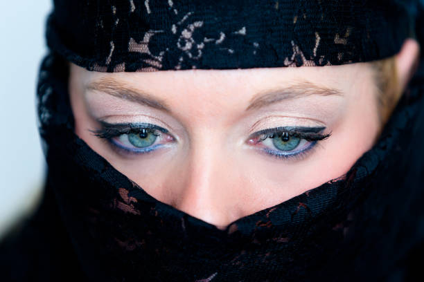istock Veiled woman with blue eyes 859649546