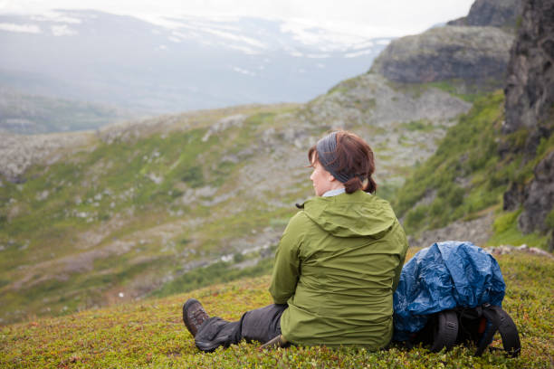 istock A mountain hiker rests and enjoys the surroundings. 859655724