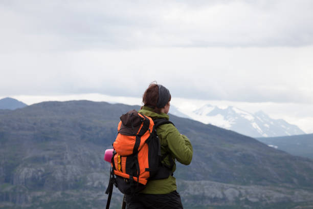 istock A female mountain hiker goes by looking ahead 859655768