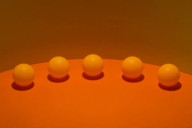 istock Abstract still life with orange balls on a colorful background 859655770