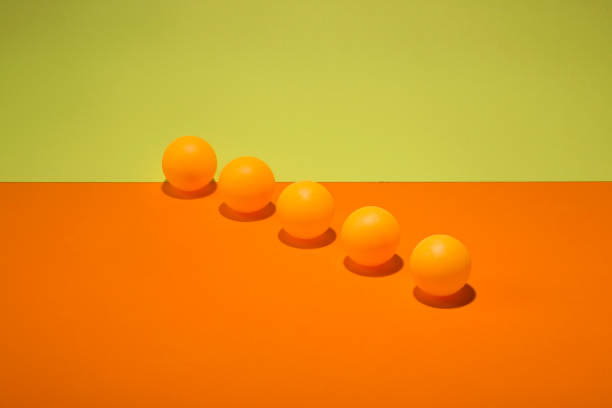 istock Abstract still life with orange balls on a colorful background 859655788