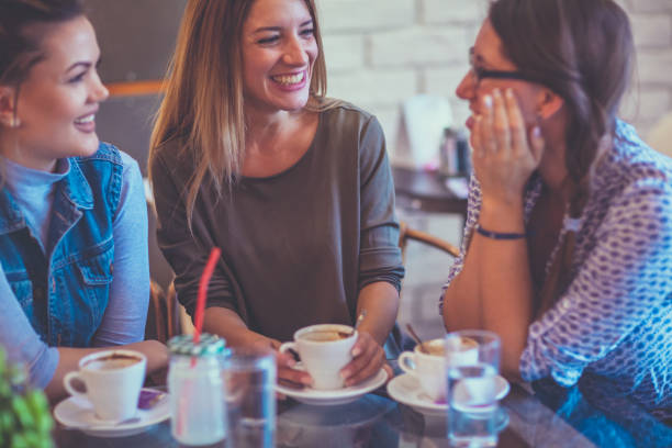 istock Female friends talking in cafe 859659094