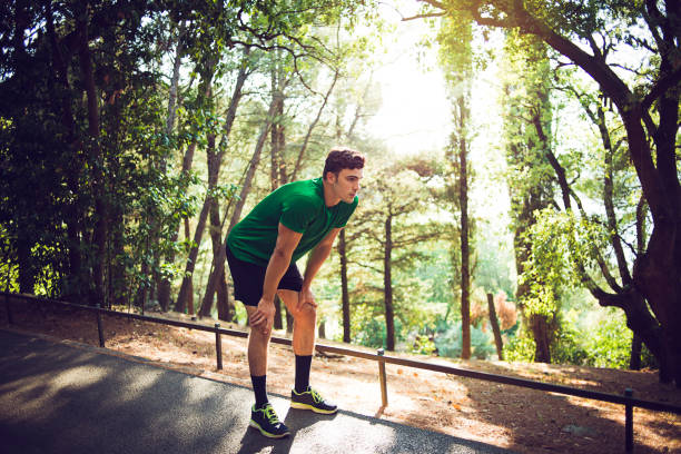 istock young man exercising in nature 859665388