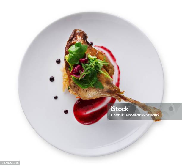 Duck Confit With Berry Sauce Isolated On White Stock Photo - Download Image Now - Gourmet, White Background, Plate