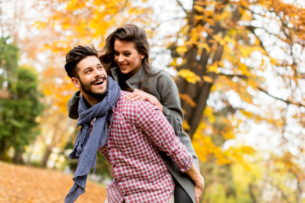 istock Lovely young couple in the autumn forest 859670120