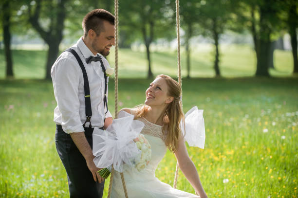 istock Bride and groom in park 859674422