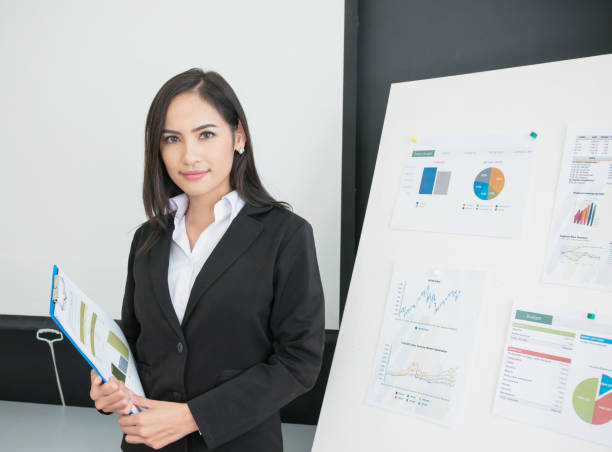 istock Smiling businesswoman crossed arm with chart background 859674828