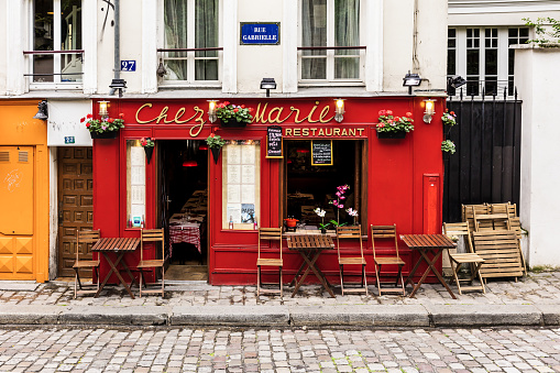 Paris, France - July 06, 2017: The charming restaurant Chez Marie on Montmartre hill. Montmartre with traditional french cafes and art galleries is one of the most visited landmarks in Paris.