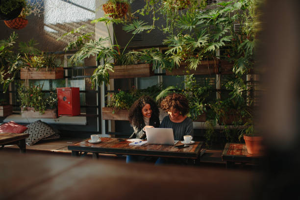 istock Women discussing ideas over coffee 859689346