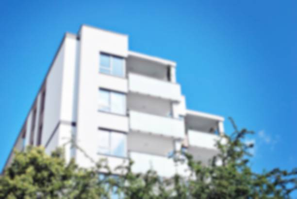 istock Abstract blur of modern apartment building. 859699854