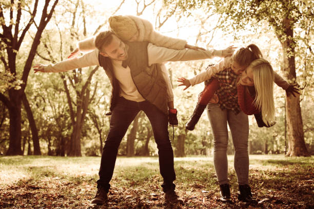 istock Smiling family in park. 859703636
