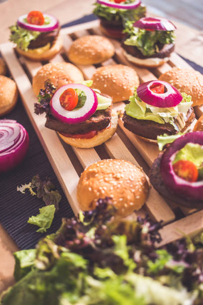 istock Open mini veggie burguers with condiments 859707602