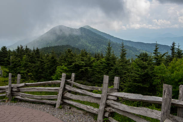 Split Rail Fence and Foggy Mt Craig Split Rail Fence and Foggy Mt Craig along Blue Ridge parkway mt mitchell stock pictures, royalty-free photos & images