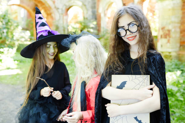 istock Girl with halloween book 859719798