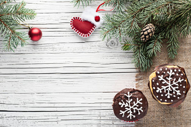 istock christmas decorated cupcakes on white wooden background top view 859720354