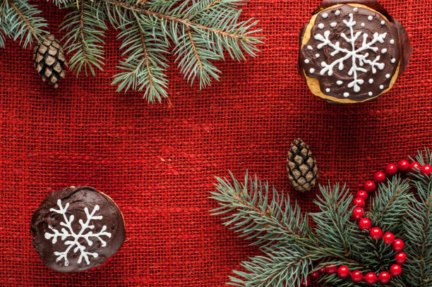 istock christmas decorated cupcakes at red burlap background top view 859723944