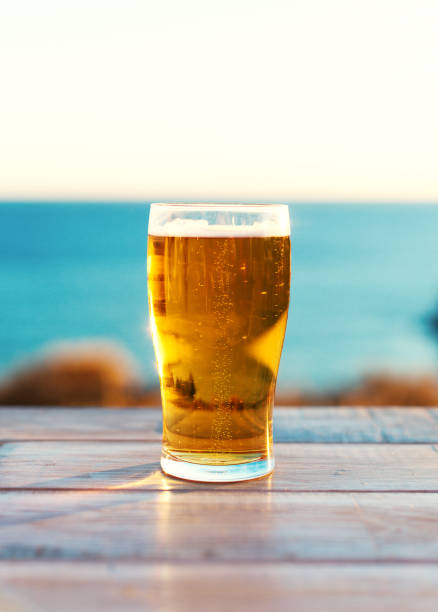 istock Glass of beer on the sunset. 859726986