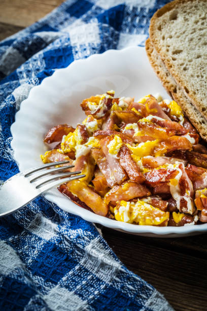 istock Pieces of sausage fried with egg. 859727682