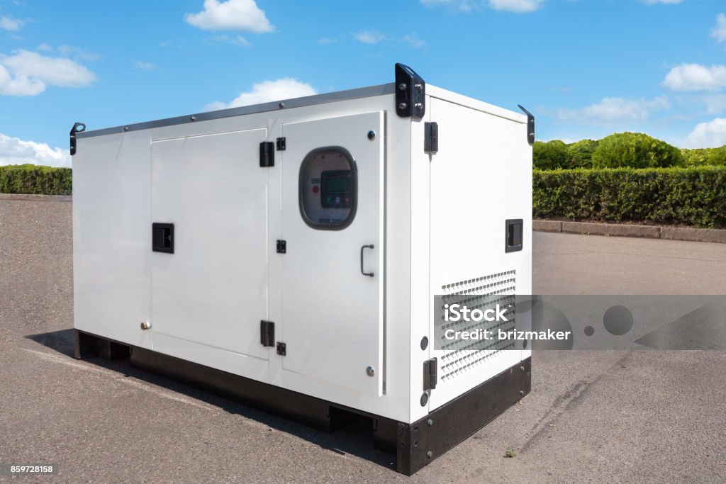 Industrial Diesel Generator. Standby generator. Industrial Diesel Generator for Office Building connected to the Control Panel with Cable Wire. Backup Generator Power. Generator Stock Photo