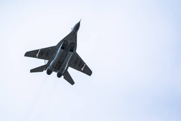 istock Military fighter airplane flying over 859731080