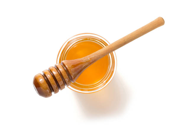istock glass jar of honey on white background 859731424