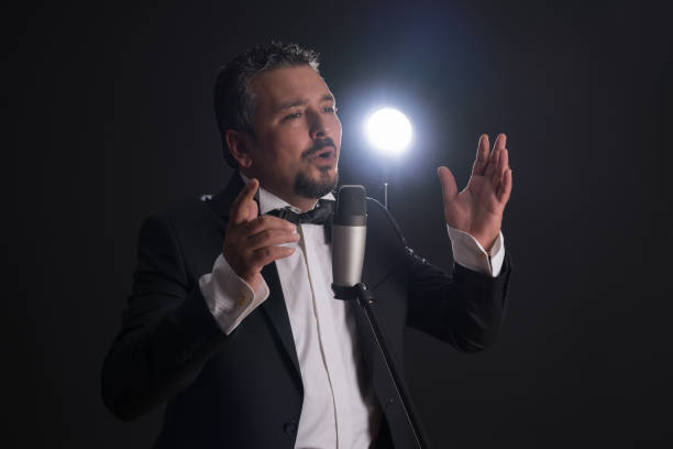 istock Caucasian adult singer over blackbackground 859731954