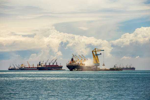 cargo ship in the trade port , container , shipping , logistics , transportation systems - coal crane transportation cargo container imagens e fotografias de stock