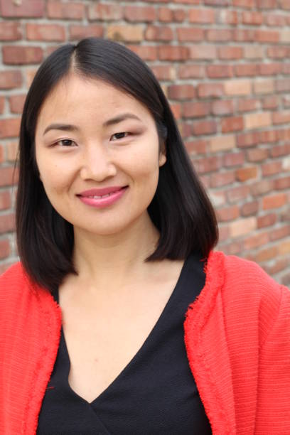 istock Determined looking Asian working woman smiling 859735726