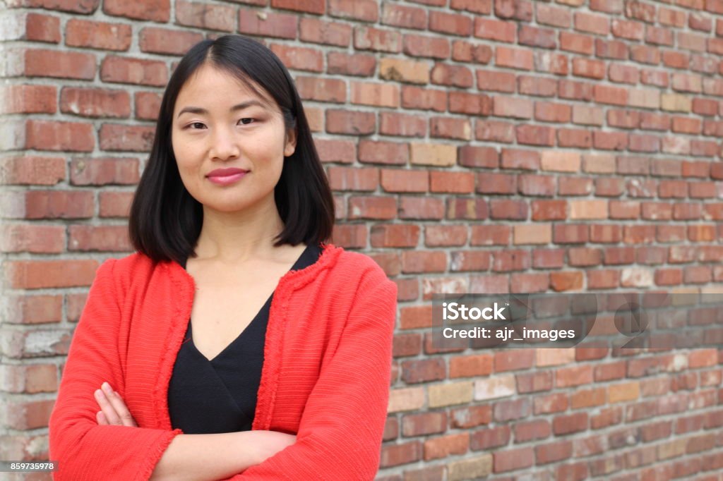 Determined looking Asian working woman with copyspace Determined looking Asian working woman with copy space. Women Stock Photo
