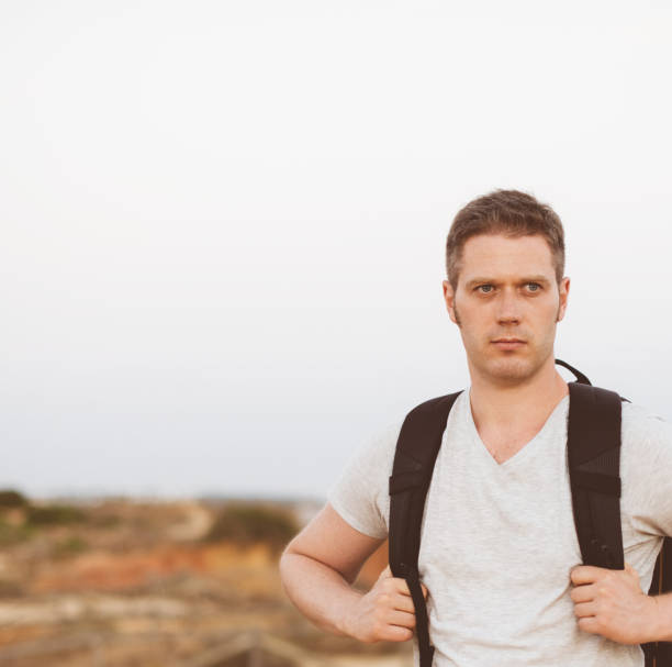 istock Handsome male tourist with backpack. Space for text. 859736054