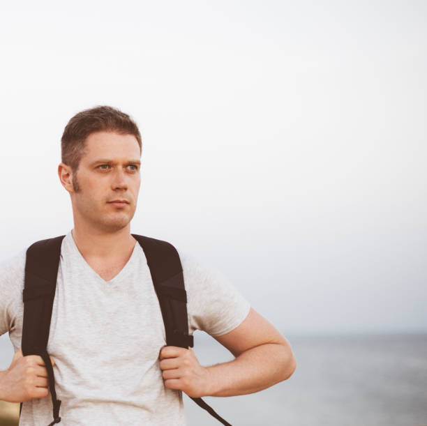 istock Handsome male tourist with backpack. Space for text. 859736072