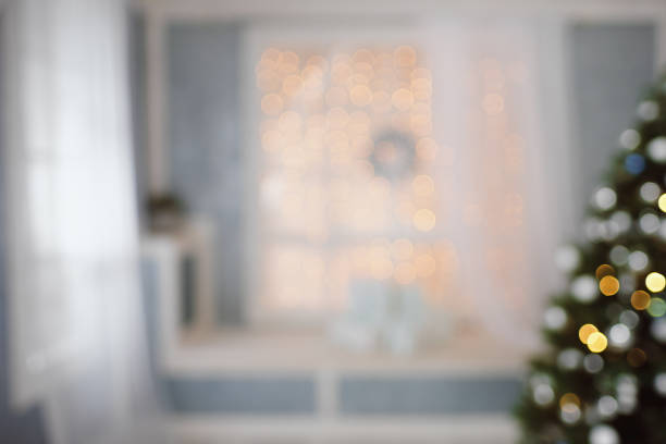 istock Bright christmas interior with tree, window and gifts in bokeh 859736108