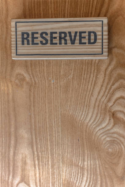 istock Coffee shop reserved sign on the table. 859740388
