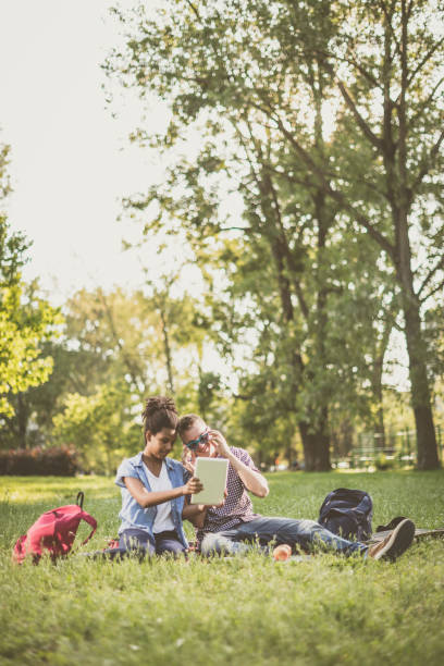 istock Two teenagers in park having fun 859743448