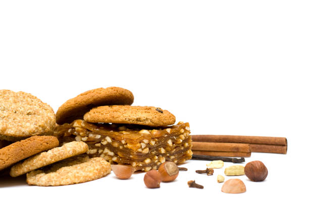 istock Christmas Spicy Cake, Nuts and Spice Isolated on white 859743474