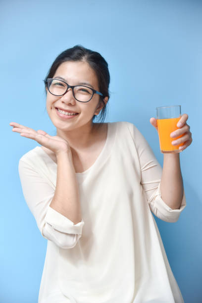 istock Woman with Orange juice. 859744210