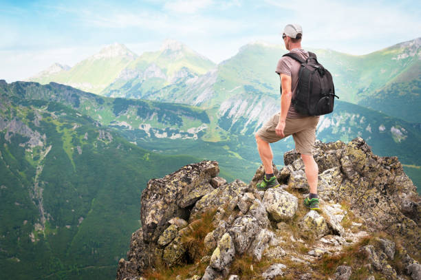 istock Hiker standing on top of the mountain 859747566