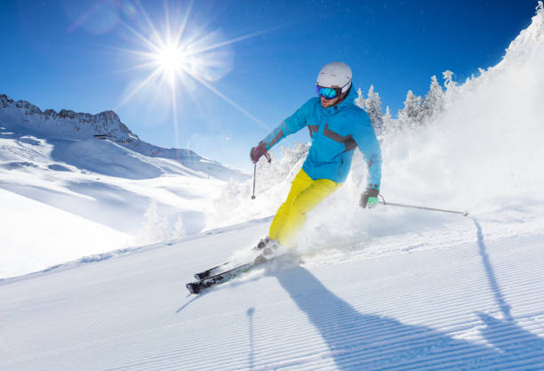 istock Young man skier running down the slope in Alpine mountains 859747772