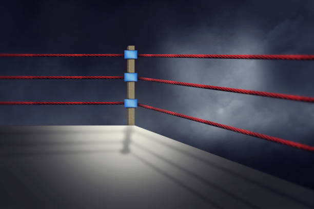 istock View of a regular boxing ring surrounded by red ropes spotlit by a spotlight 859751800
