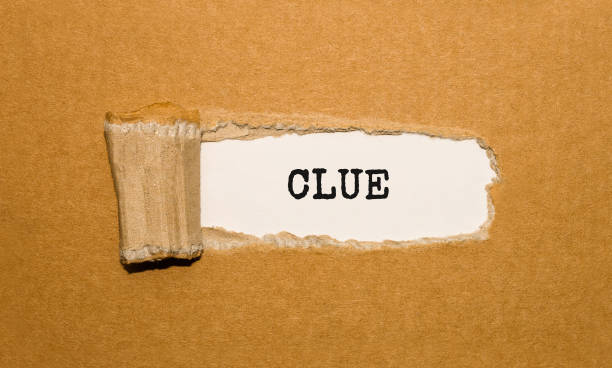 istock The text CLUE appearing behind torn brown paper 859753042