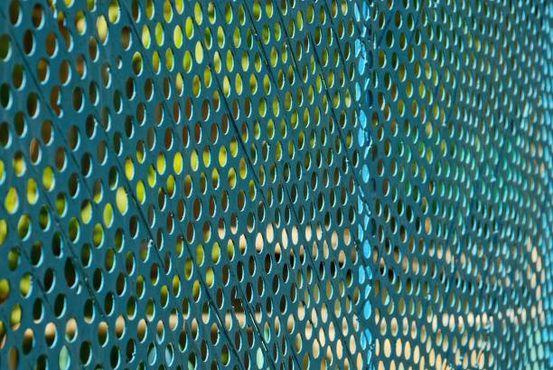 istock Iron texture from an old blue grid of fencing 859756206