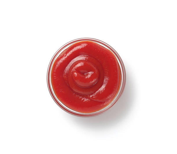istock tomato sauce in bowl and jar on table 859766668