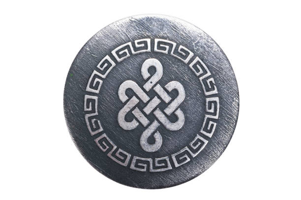intricate ornament on a metal pendant, isolated