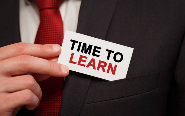 istock Businessman putting a card with text Time to Learn in the pocket 859770998