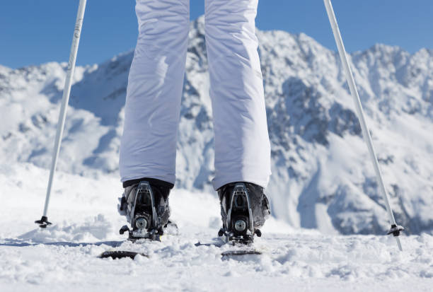 istock Young woman with ski on mountains 859772174